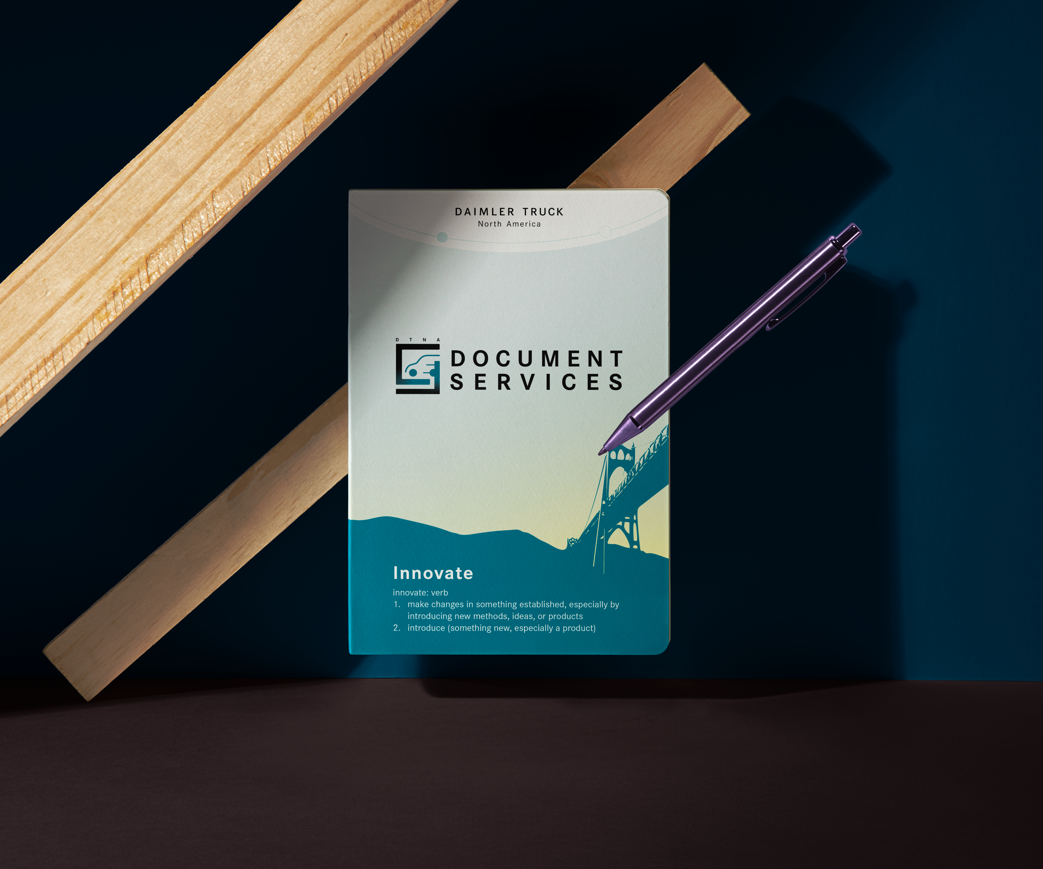 Document Services notebook with a bridge graphic and the word ‘Innovate’ on the cover.